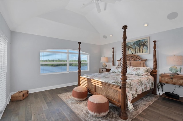 bedroom featuring ceiling fan, dark hardwood / wood-style floors, and vaulted ceiling