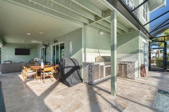 view of patio with exterior kitchen and glass enclosure