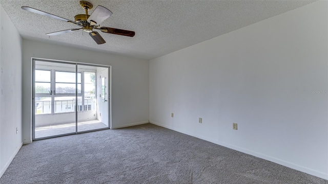 spare room with ceiling fan, a textured ceiling, and carpet flooring