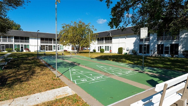 view of home's community featuring a yard