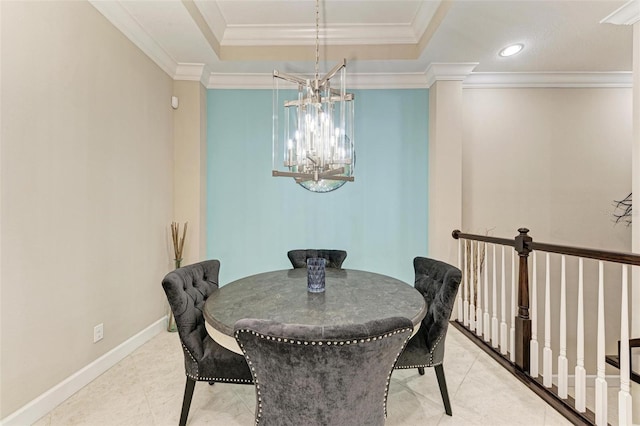 dining area featuring light tile patterned floors, a notable chandelier, a tray ceiling, and ornamental molding