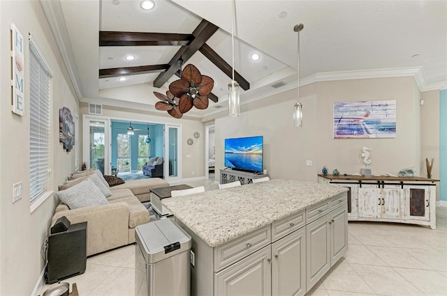 kitchen with a kitchen island, hanging light fixtures, lofted ceiling with beams, ceiling fan, and light tile patterned floors