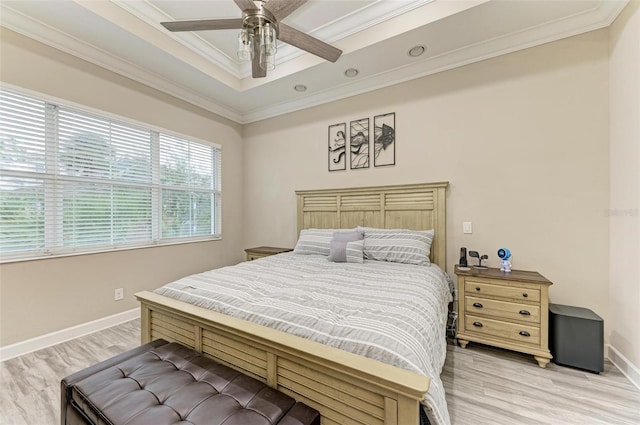 bedroom featuring ceiling fan, light hardwood / wood-style flooring, and ornamental molding