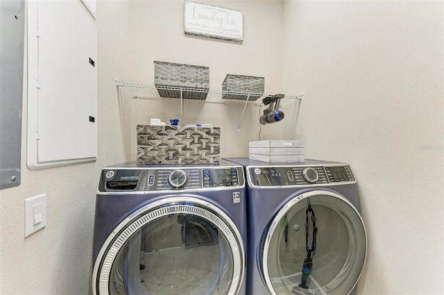 laundry room with independent washer and dryer and electric panel