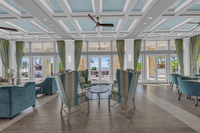 sunroom featuring ceiling fan, french doors, and coffered ceiling