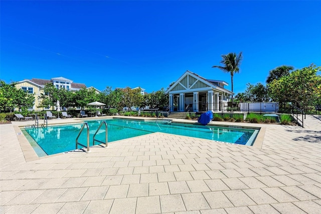 view of swimming pool with a patio area