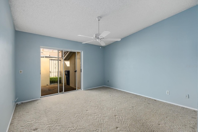 unfurnished bedroom with ceiling fan, light colored carpet, and a textured ceiling