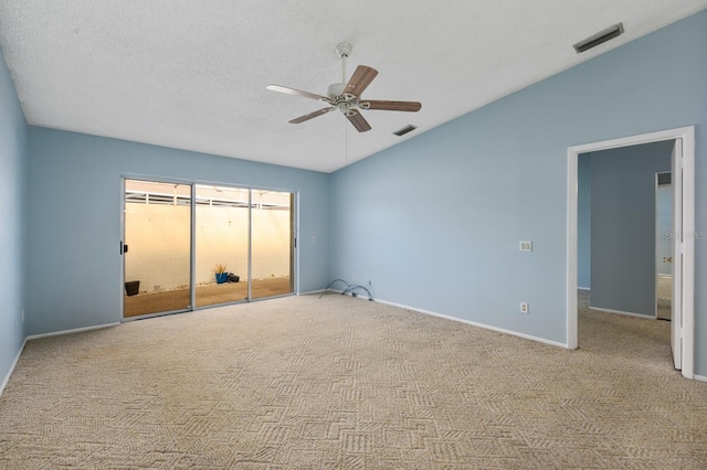 unfurnished bedroom with light carpet, a textured ceiling, a closet, and ceiling fan