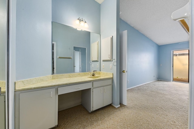 bathroom with vanity and a textured ceiling