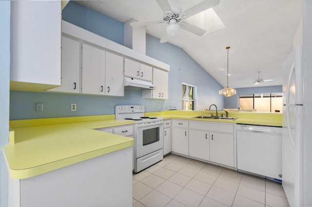 kitchen featuring white appliances, white cabinets, sink, vaulted ceiling, and kitchen peninsula