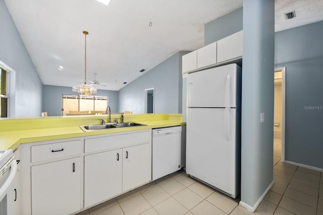 kitchen with white cabinetry, sink, hanging light fixtures, vaulted ceiling, and white appliances