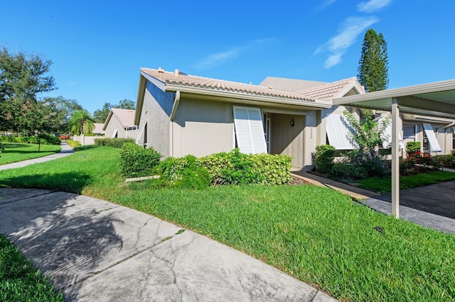 view of side of home with a yard