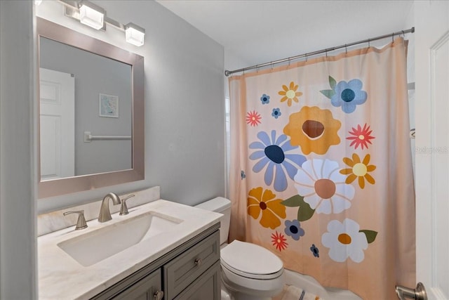 bathroom with vanity, toilet, and a shower with shower curtain