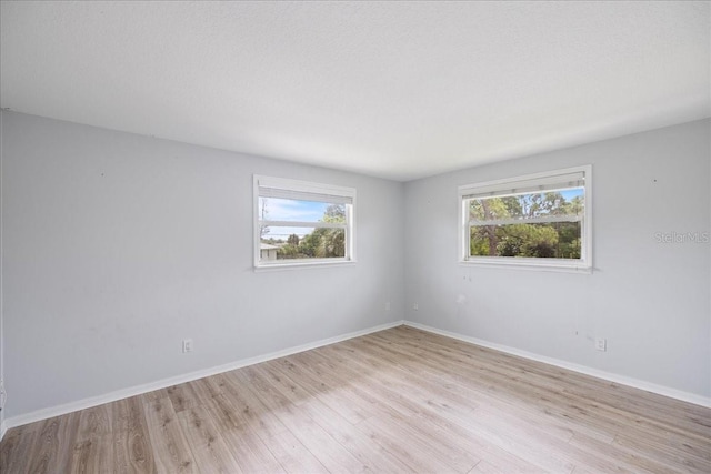 empty room with light wood-type flooring