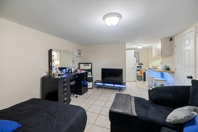 bedroom with a wall mounted AC and light tile patterned flooring