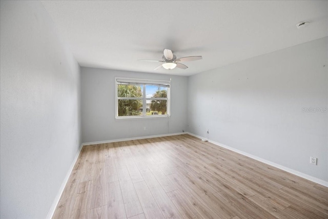 empty room with light wood-type flooring and ceiling fan