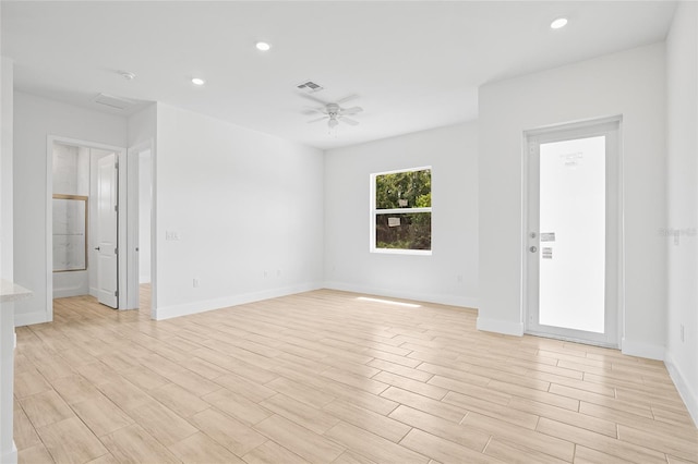 spare room featuring ceiling fan and light wood-type flooring