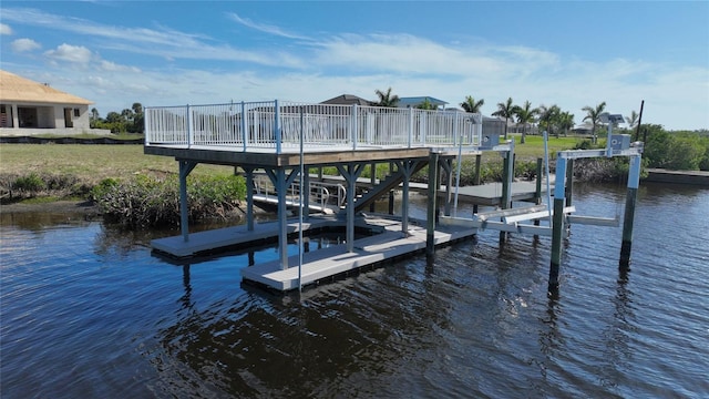 dock area featuring a water view and boat lift