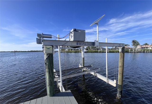 dock area featuring a water view and boat lift