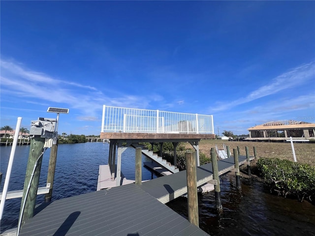 view of dock with a water view and boat lift