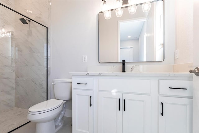 bathroom with a shower stall, toilet, and vanity