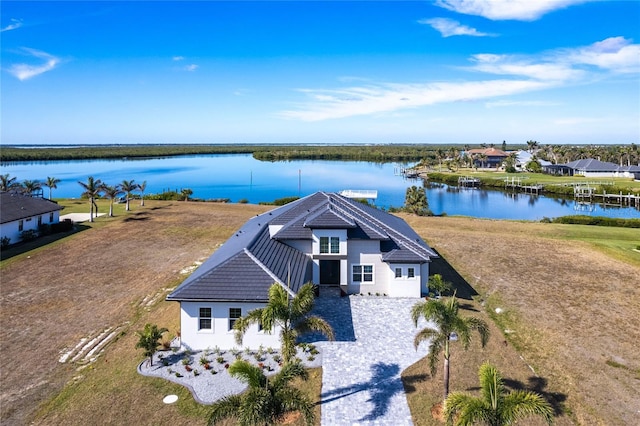 birds eye view of property with a water view