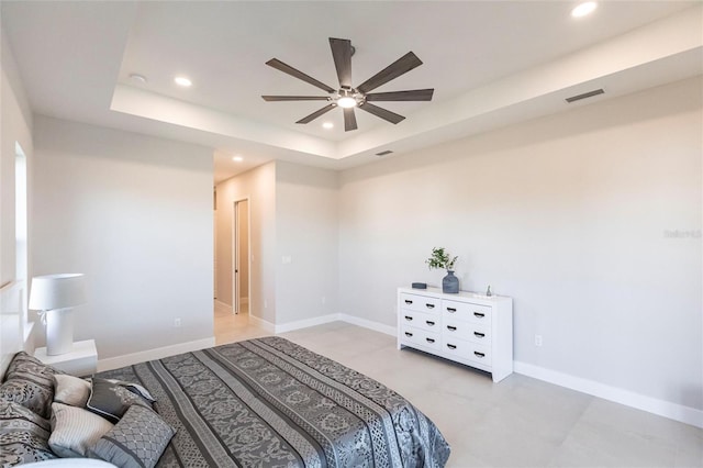 bedroom featuring baseboards, visible vents, a raised ceiling, and recessed lighting