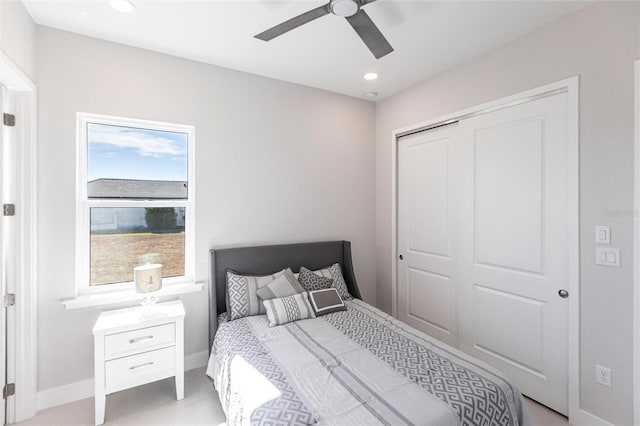 bedroom with a closet, recessed lighting, a ceiling fan, and baseboards