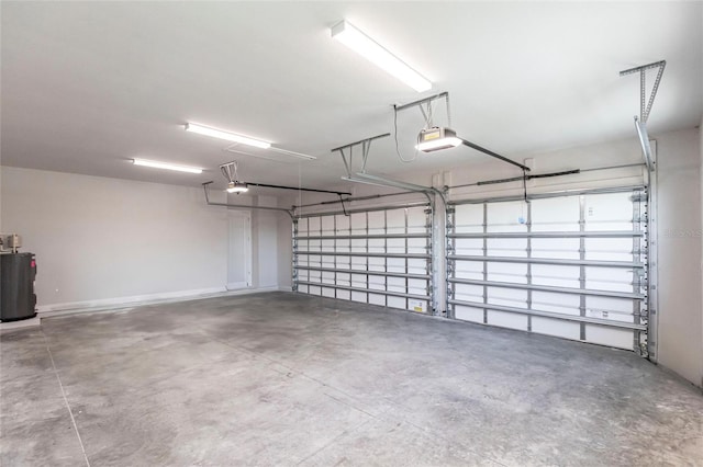 garage with water heater and a garage door opener