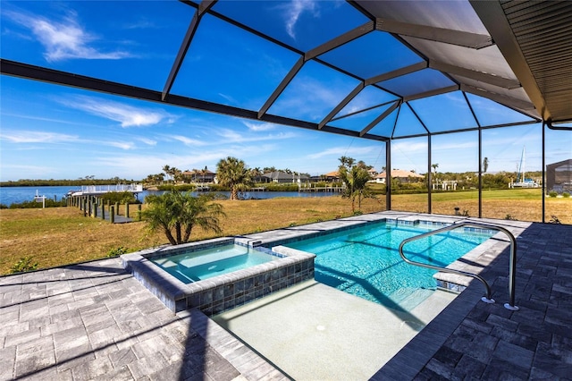 view of swimming pool featuring a yard, a patio, a water view, and a lanai