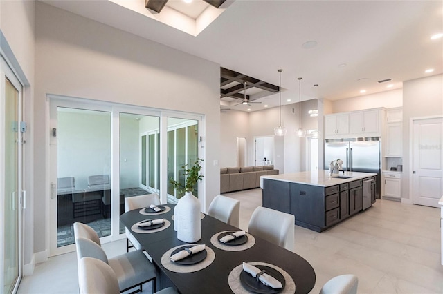 dining space with a high ceiling, beamed ceiling, coffered ceiling, and recessed lighting