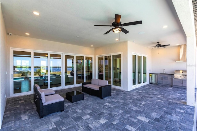 view of patio with ceiling fan, an outdoor hangout area, area for grilling, a sink, and grilling area