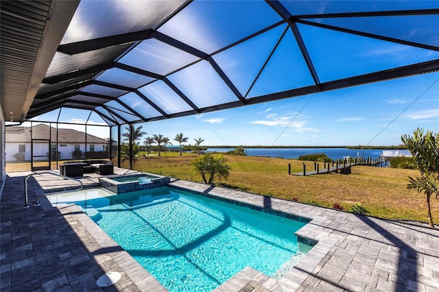 view of swimming pool featuring a patio, a water view, a yard, a pool with connected hot tub, and an outdoor living space