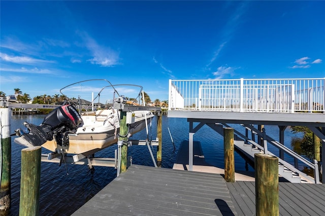 view of dock featuring a water view and boat lift