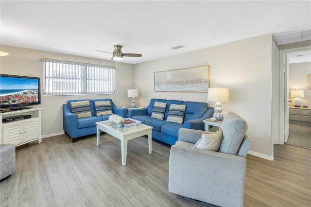 living room with hardwood / wood-style flooring and ceiling fan