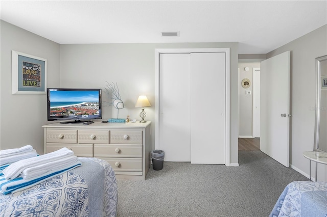 carpeted bedroom featuring a closet