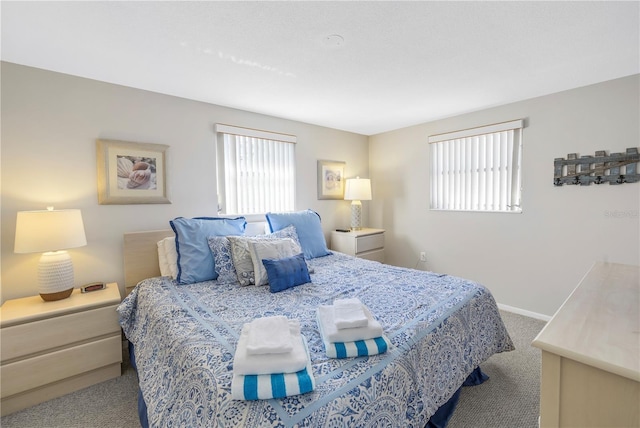 bedroom featuring light colored carpet