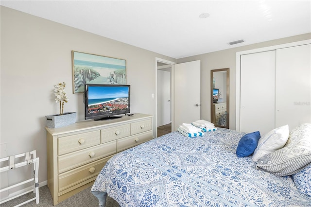 bedroom with carpet floors and a closet