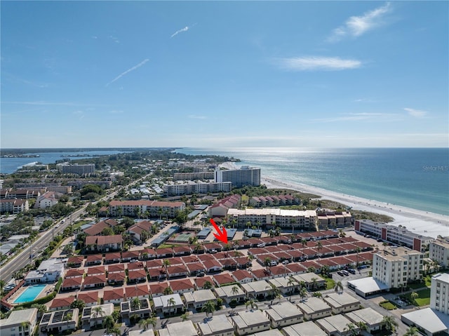 bird's eye view featuring a view of the beach and a water view