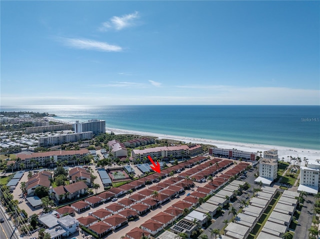 bird's eye view featuring a water view and a view of the beach