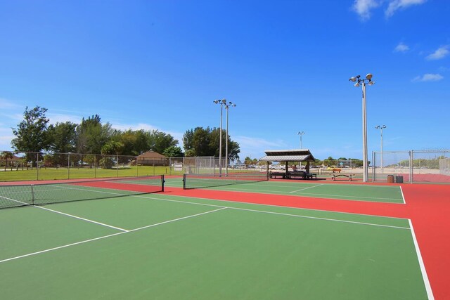 view of sport court featuring basketball hoop