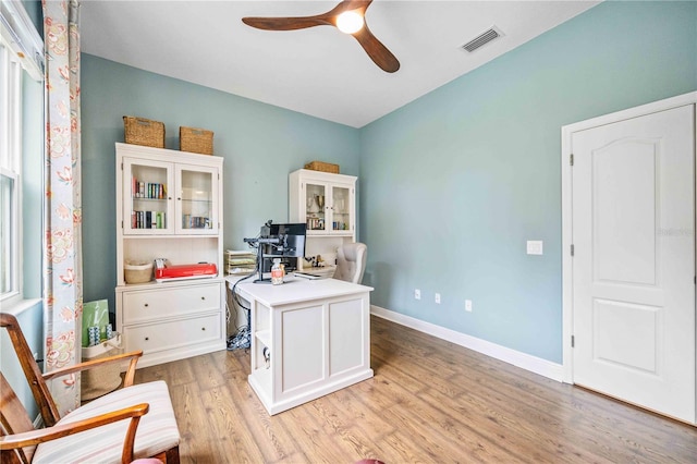 office area with ceiling fan and light hardwood / wood-style flooring