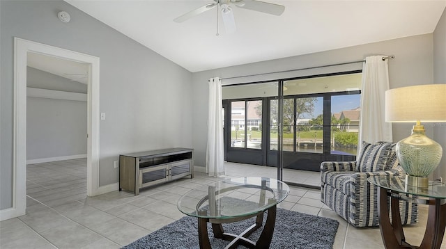 tiled living room featuring lofted ceiling and ceiling fan