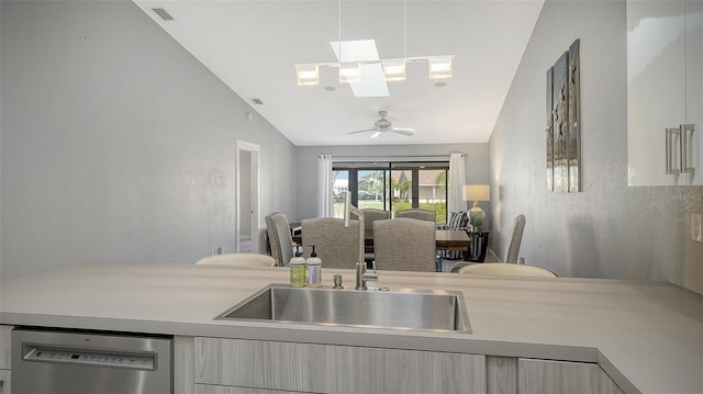 kitchen featuring vaulted ceiling, sink, ceiling fan, and dishwasher