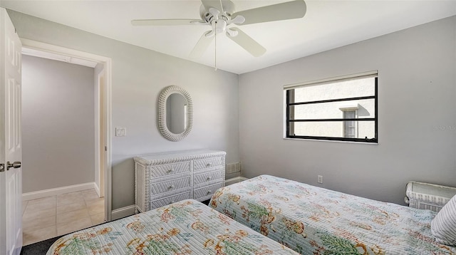 tiled bedroom with ceiling fan