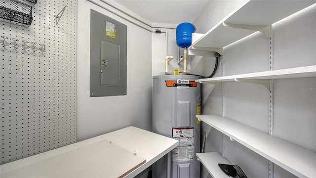 utility room featuring water heater