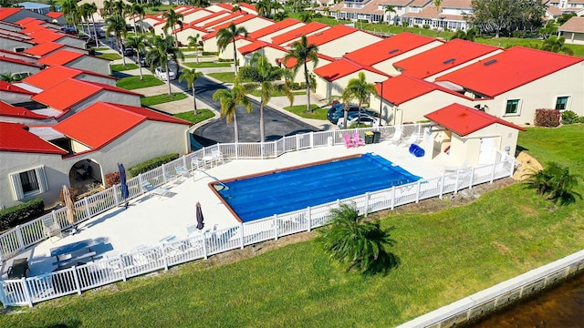 view of pool featuring a yard