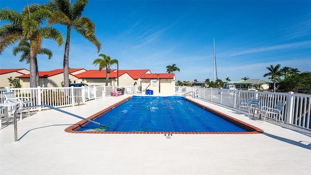 view of pool featuring a patio