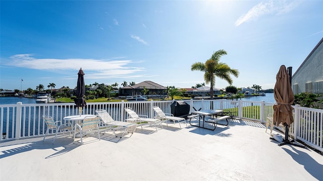 view of terrace with a water view