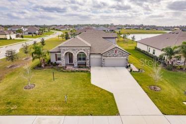 view of front of property with a front yard and a garage